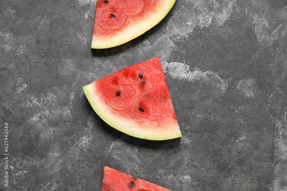 Composition with pieces of fresh ripe watermelon on dark background