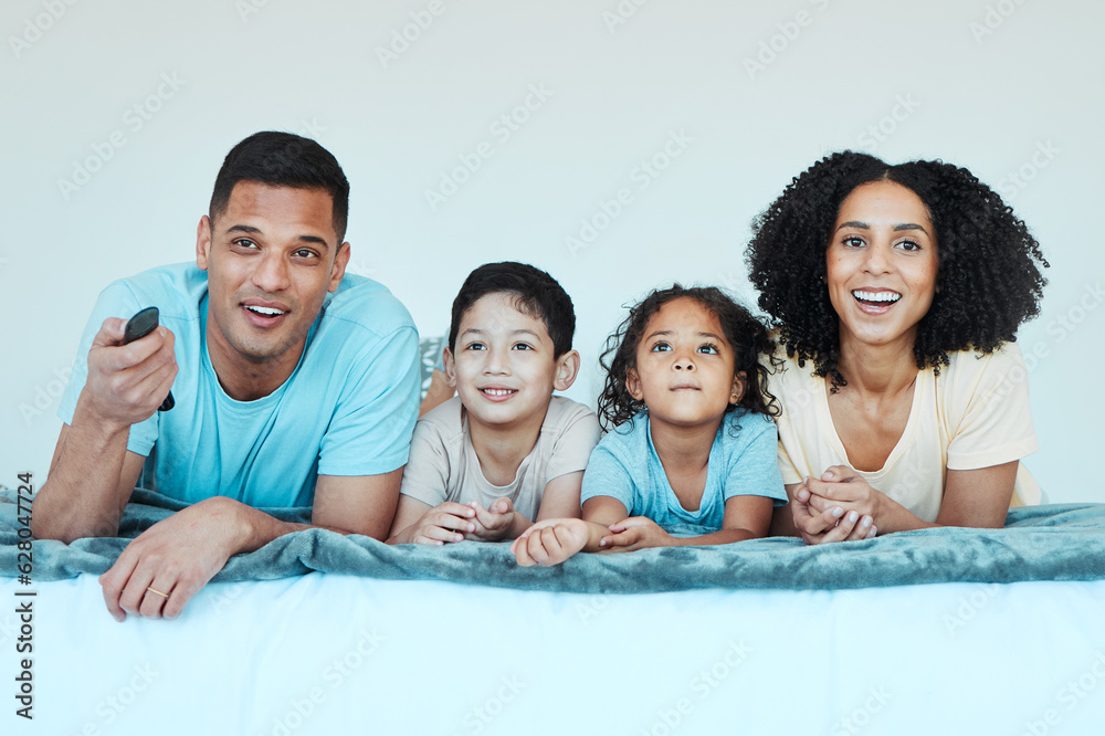 Father, mother and children on bed, watching tv and smile for comedy, comic movie and cartoon in fam