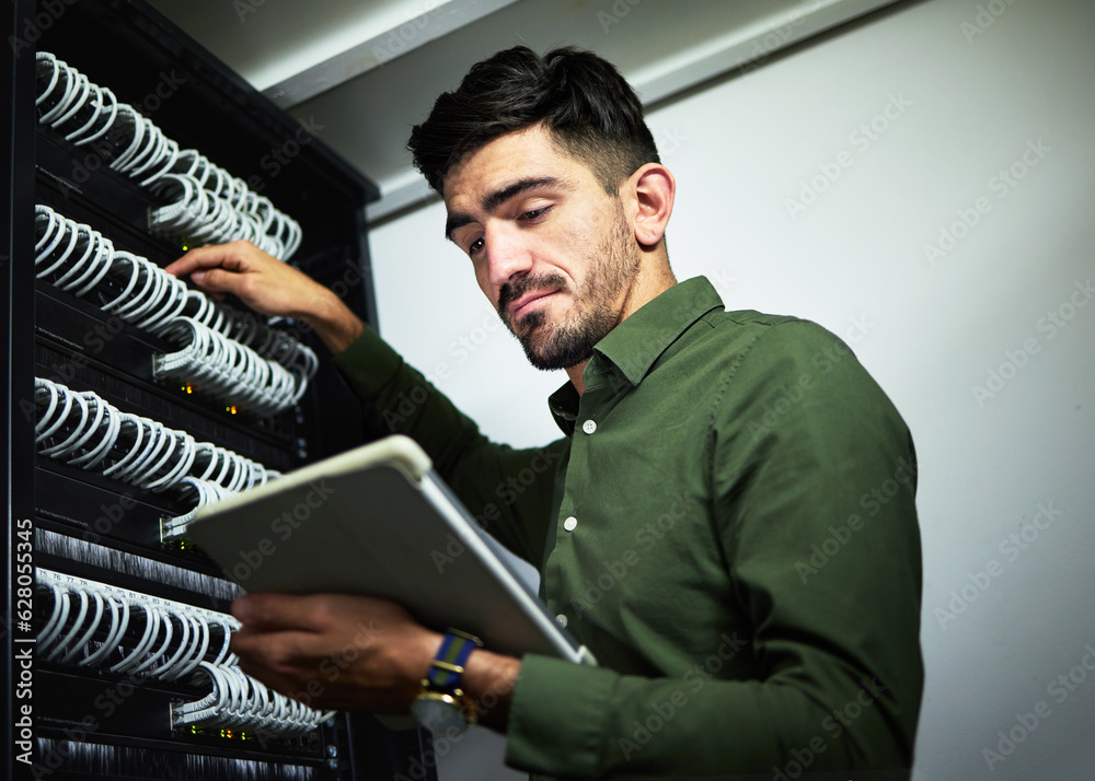 Server room, cable and engineer man with a tablet for programming, maintenance and software upgrade.