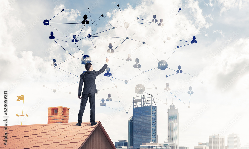 Businessman on house roof presenting networking and connection c