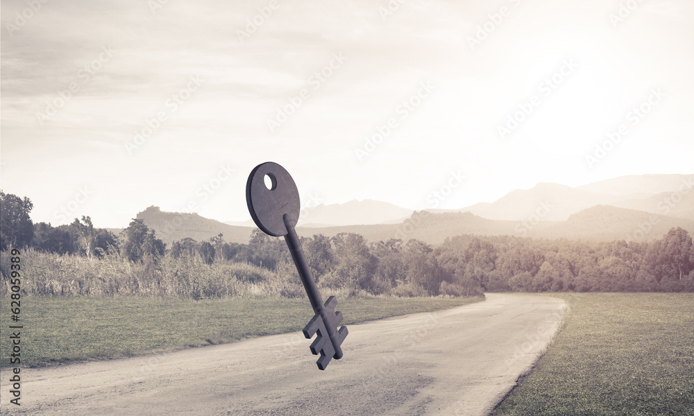 Conceptual background image of concrete key sign on asphalt road