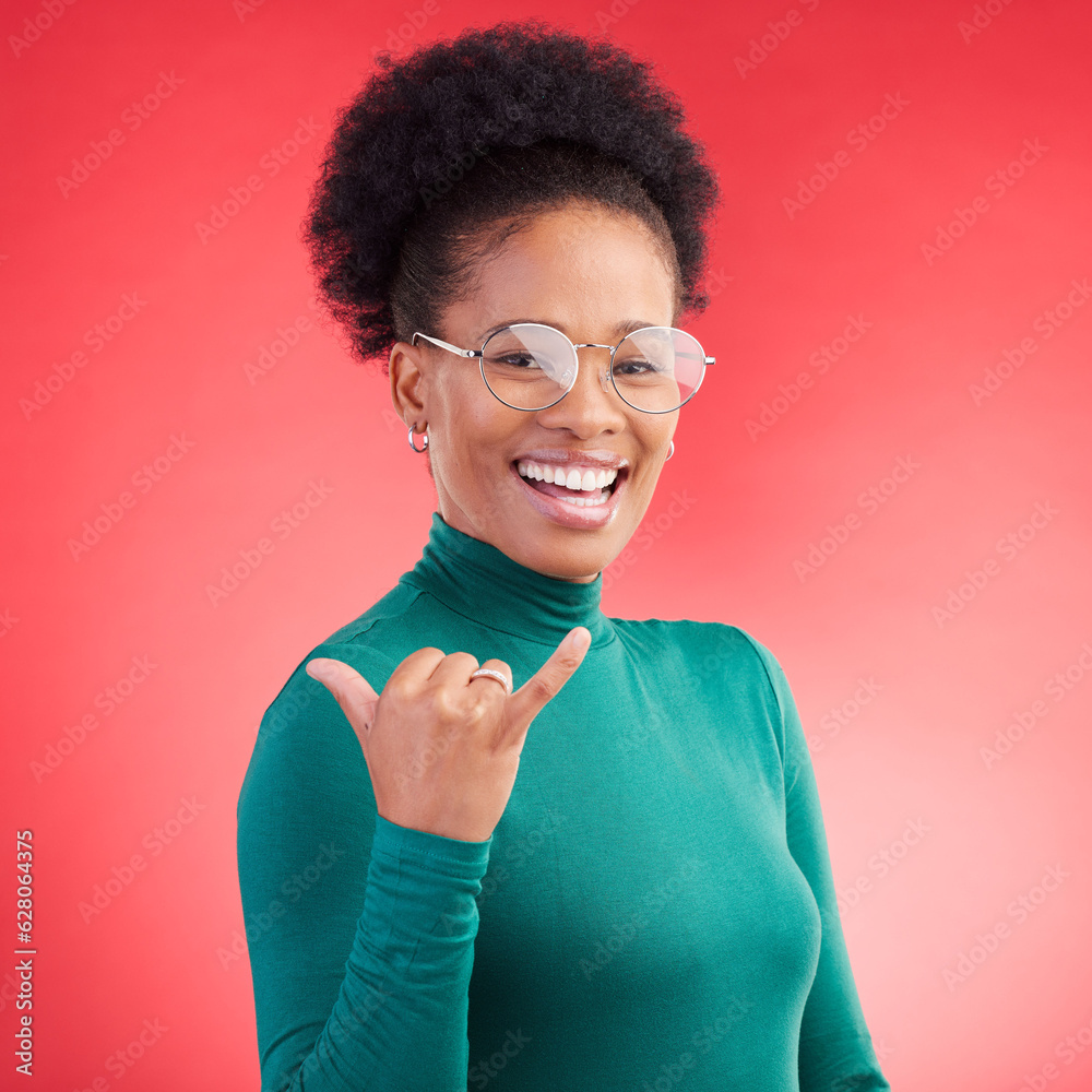 Portrait, excited and black woman with call me hand in studio isolated on a red background with glas