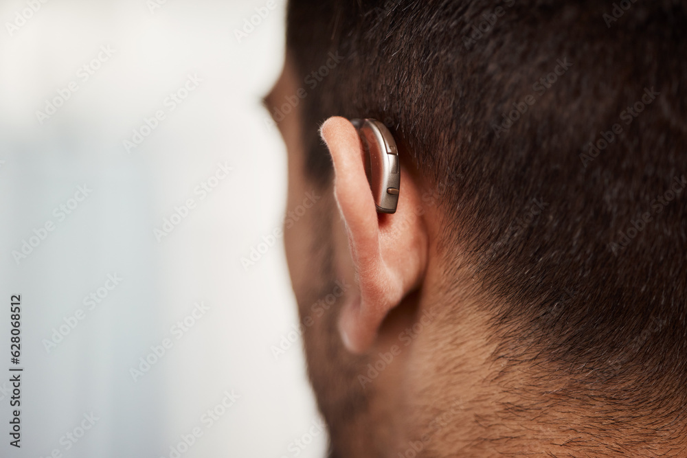 Closeup of hearing aid, ear and man with disability from the back for medical support, listening or 