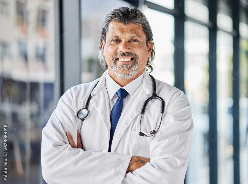 Portrait, man and doctor with arms crossed, smile and surgeon with confidence, career and medicine. 