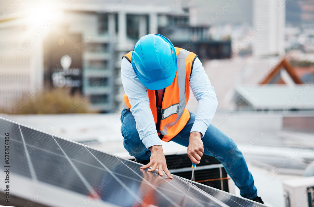 Engineer man, screwdriver and solar panel on roof for maintenance, industry and construction in city