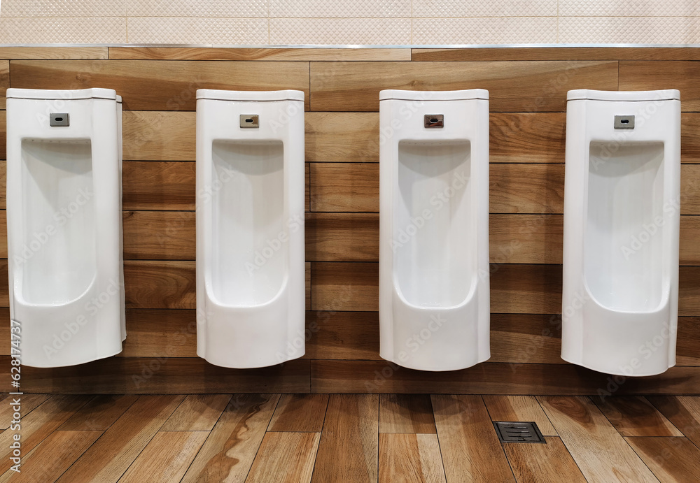 White urinals in public restrooms