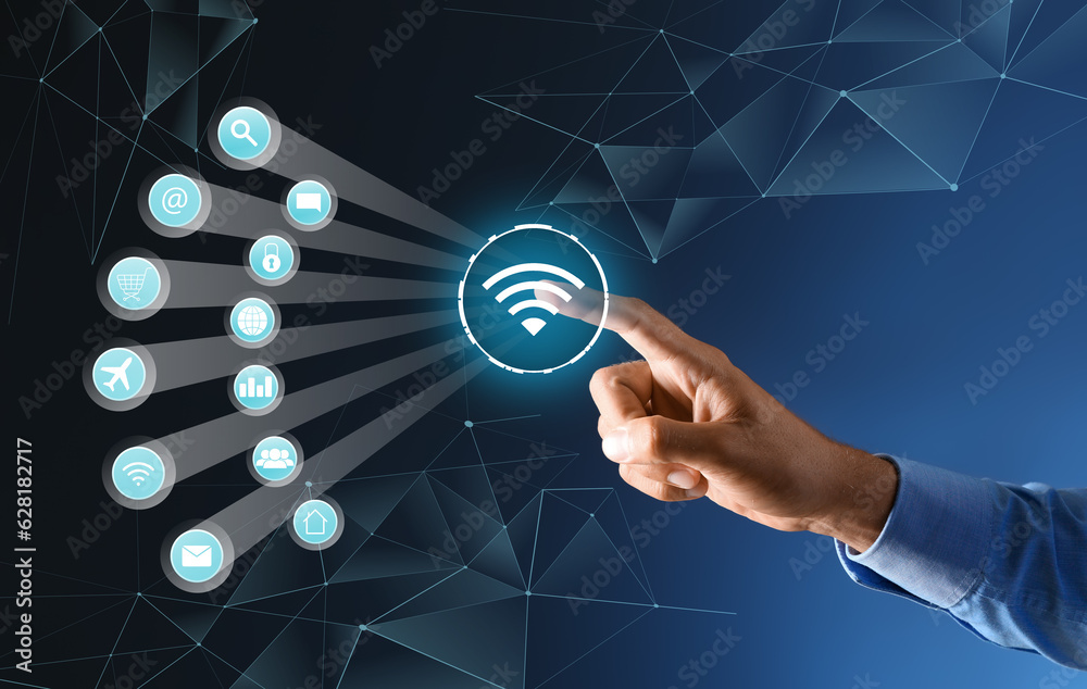 Businessman using virtual screen with digital wifi icon on dark blue background