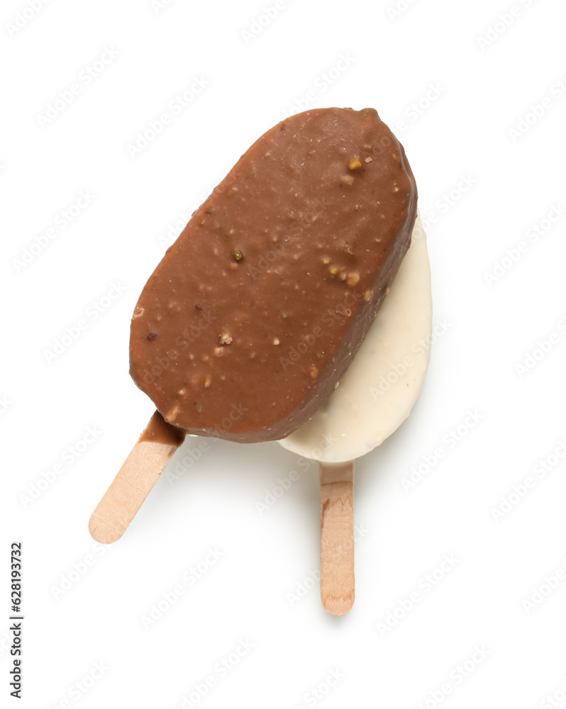 Different chocolate covered ice cream on stick against white background