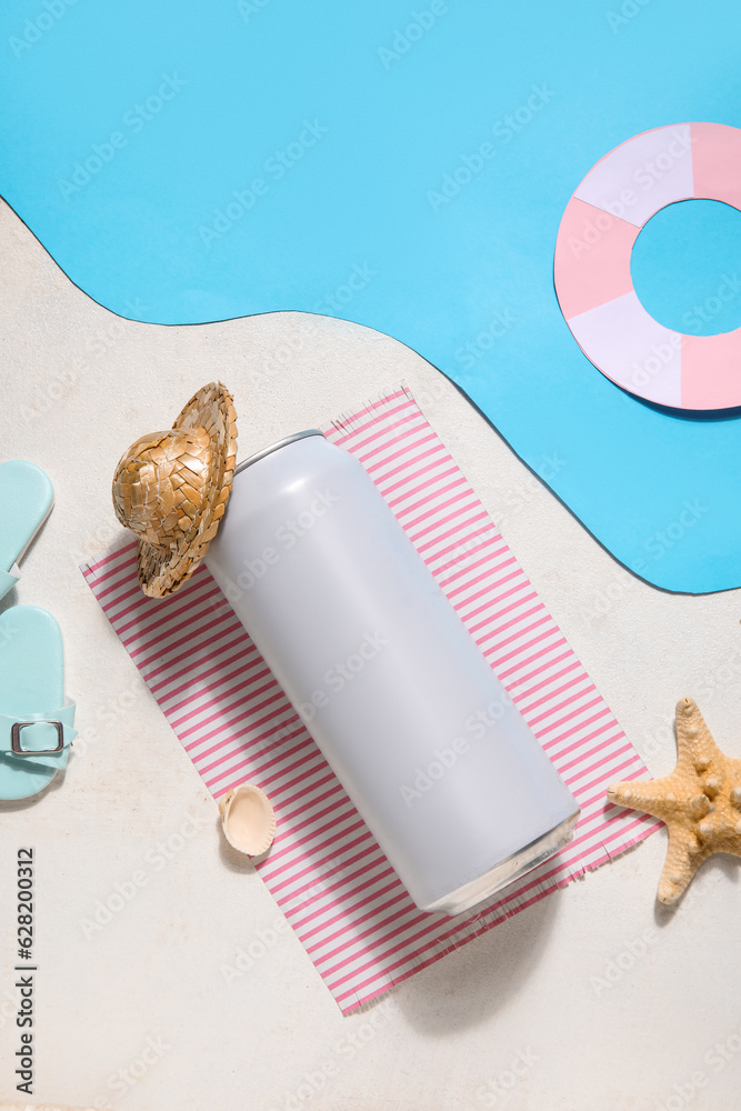 Can of soda with beach decor on color background