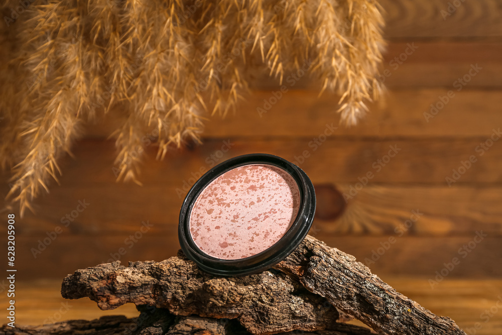 Composition with highlighter, tree bark and pampas grass on wooden background