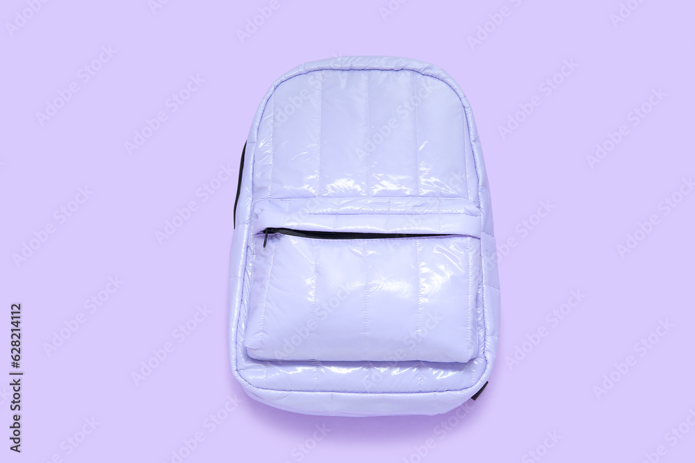 Lilac school backpack on purple background