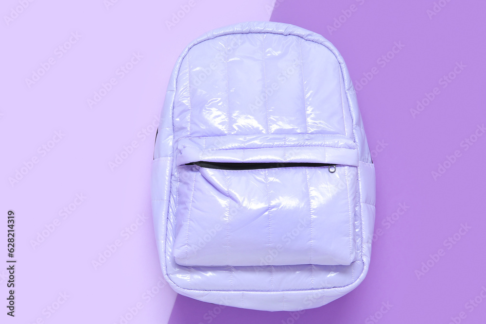 Lilac school backpack on color background