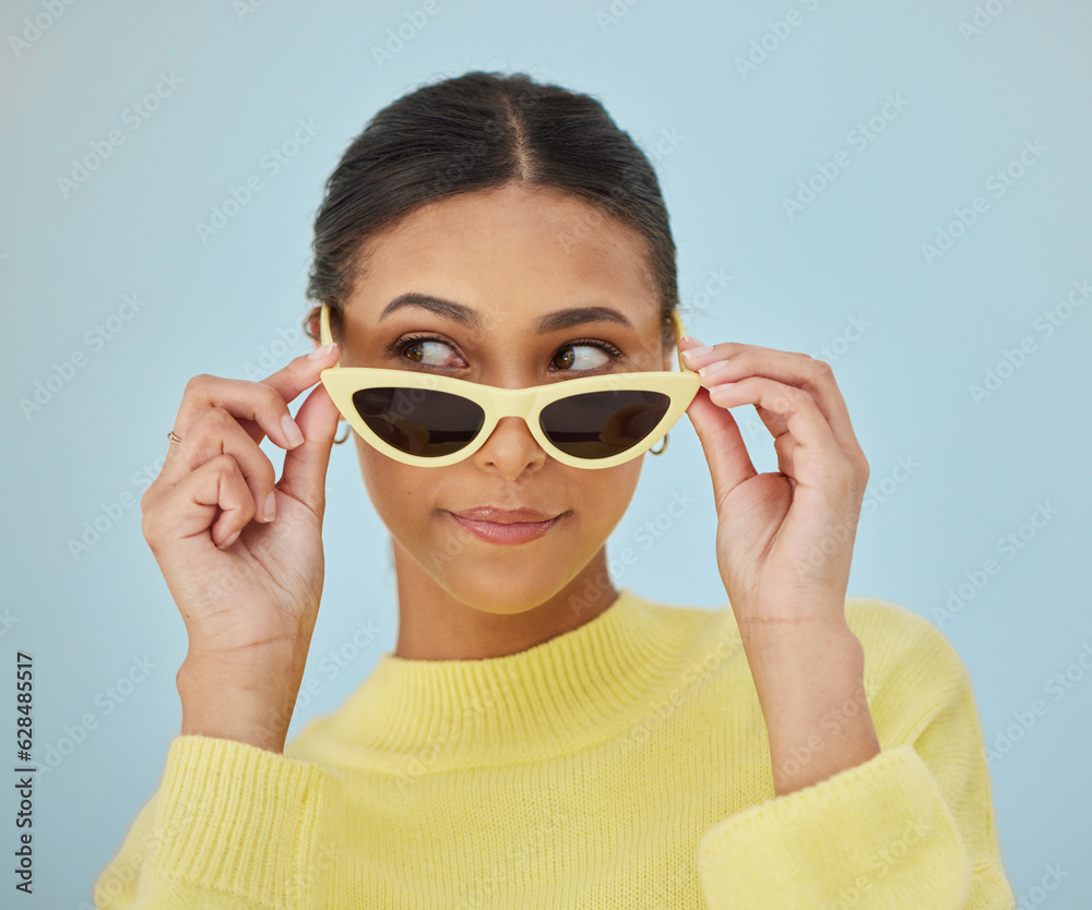 Sunglasses, gen z and young woman in a studio with a casual, stylish and cool sweater outfit. Confid