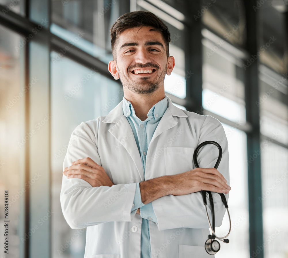 Crossed arms, happy and portrait of a male doctor with a stethoscope in a medical hospital. Confiden