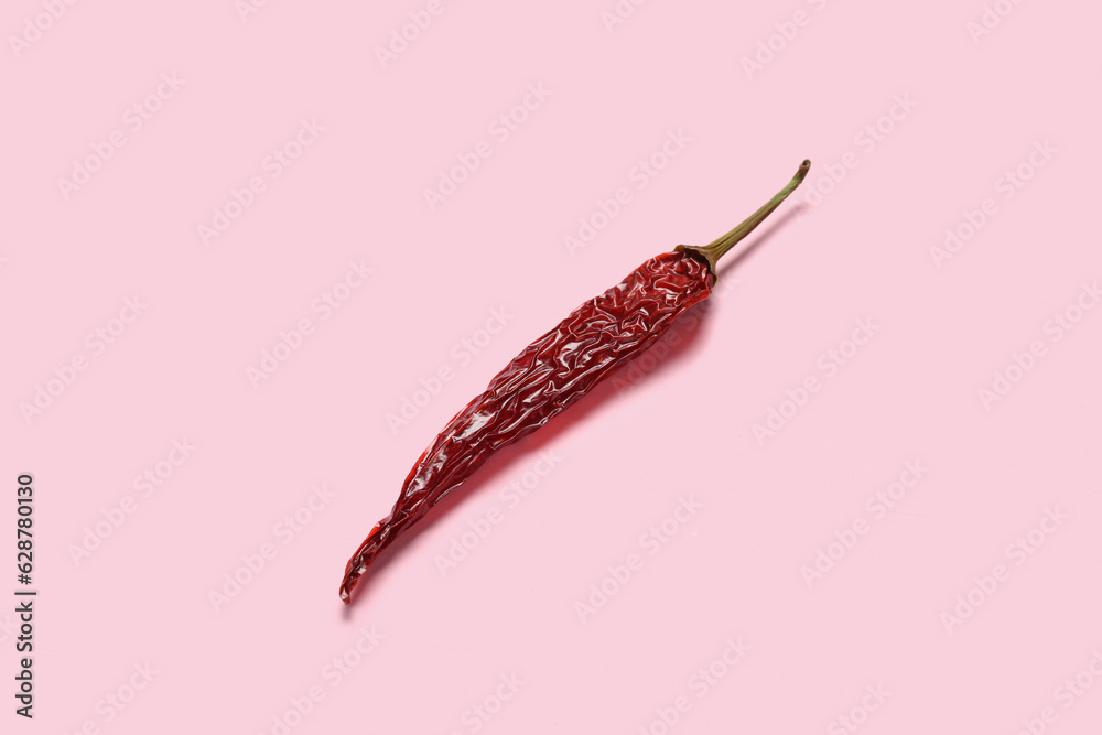 Dry hot chili pepper on pink background