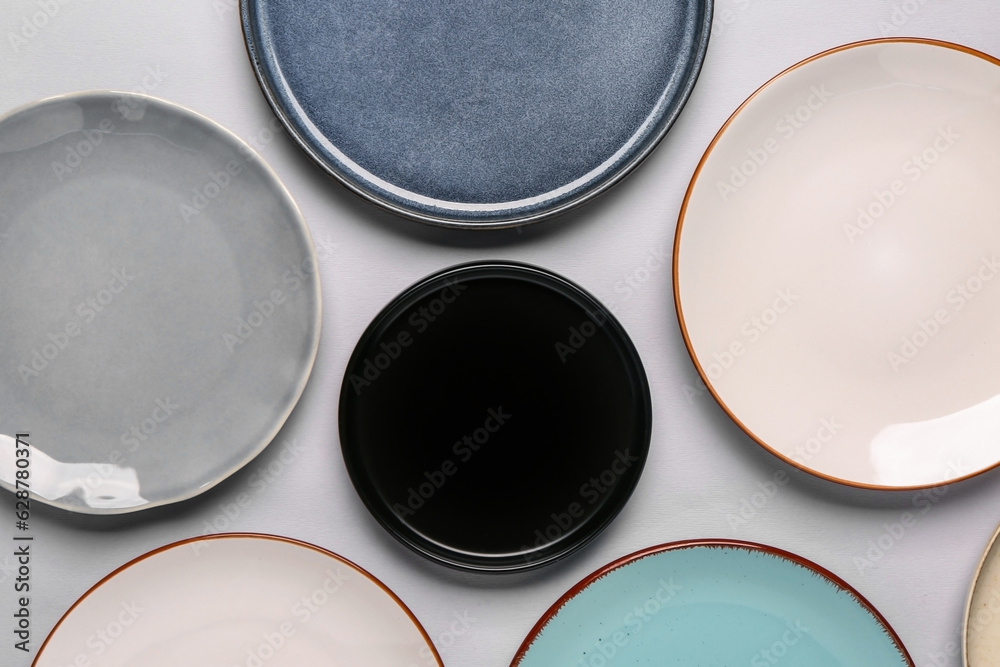 Composition with different clean plates on grey background