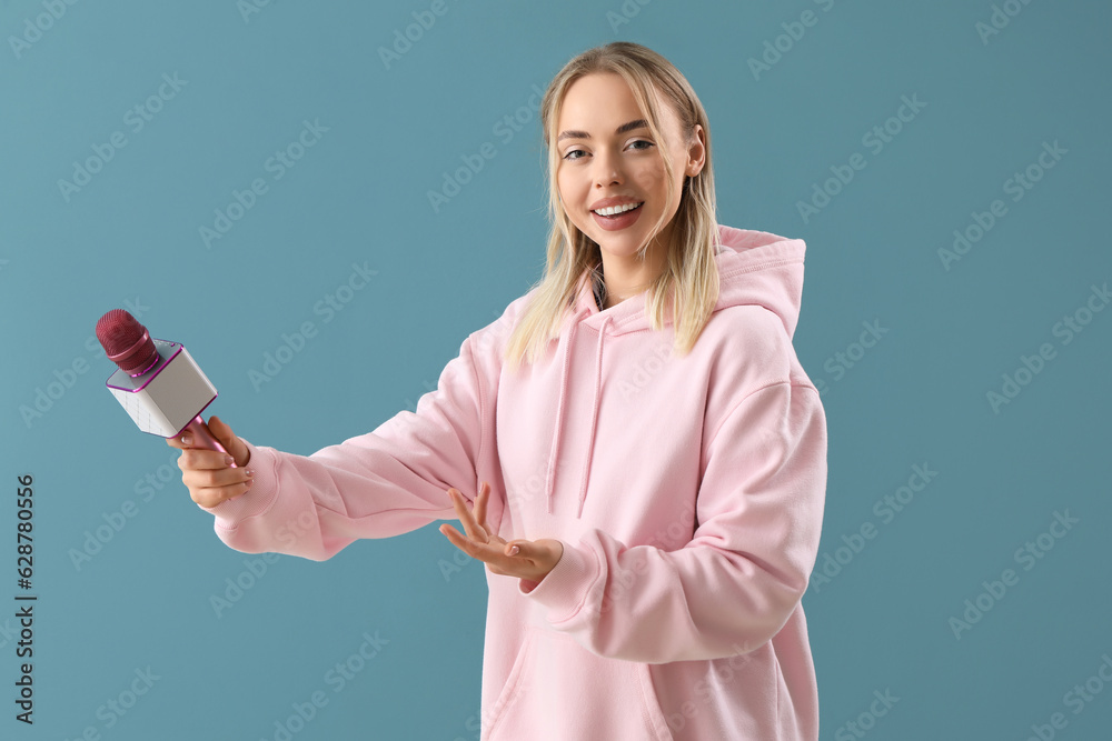 Female journalist with microphone on blue background