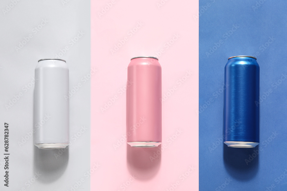 Cans of fresh soda on color background