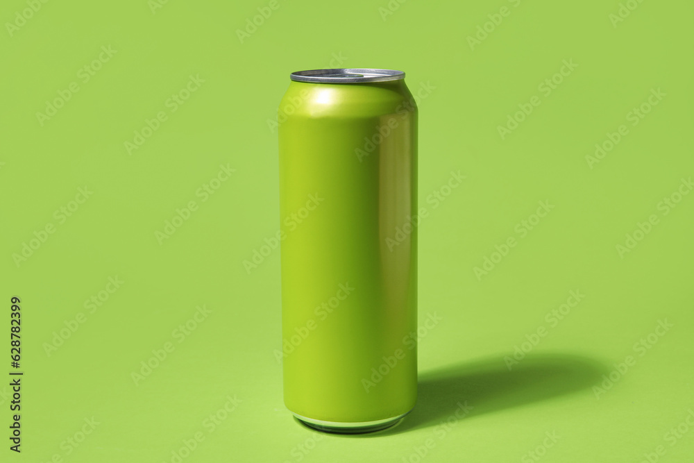 Can of fresh soda on green background