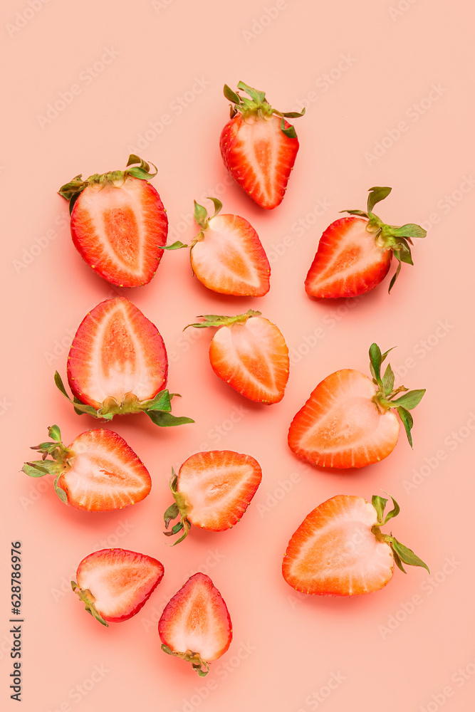 Slices of fresh strawberries on pink background