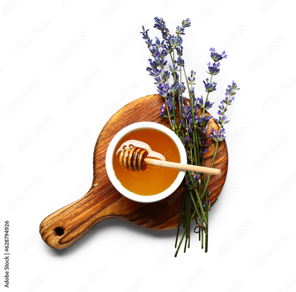 Wooden board with bowl of sweet lavender honey, dipper and flowers on white background