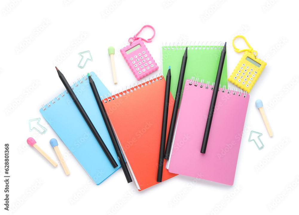 Notebooks and school stationery on white background