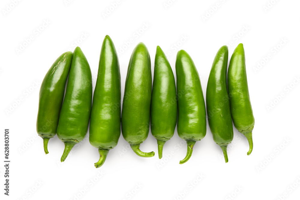 Green chili peppers on white background