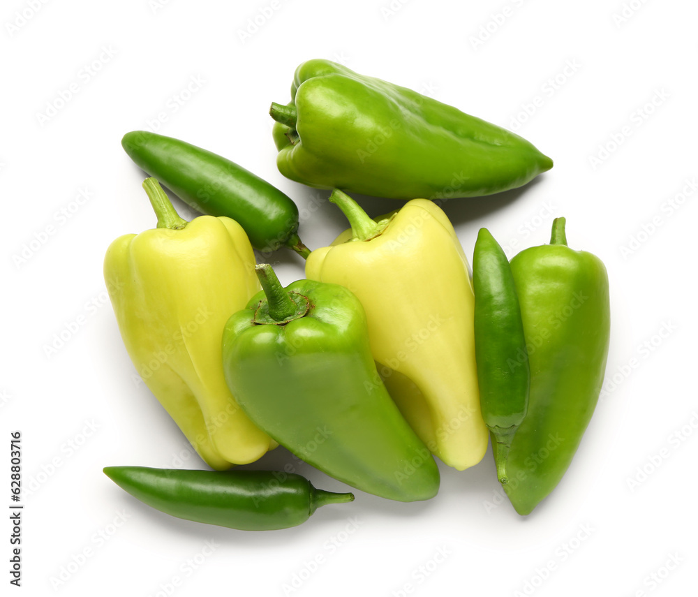 Different fresh peppers on white background