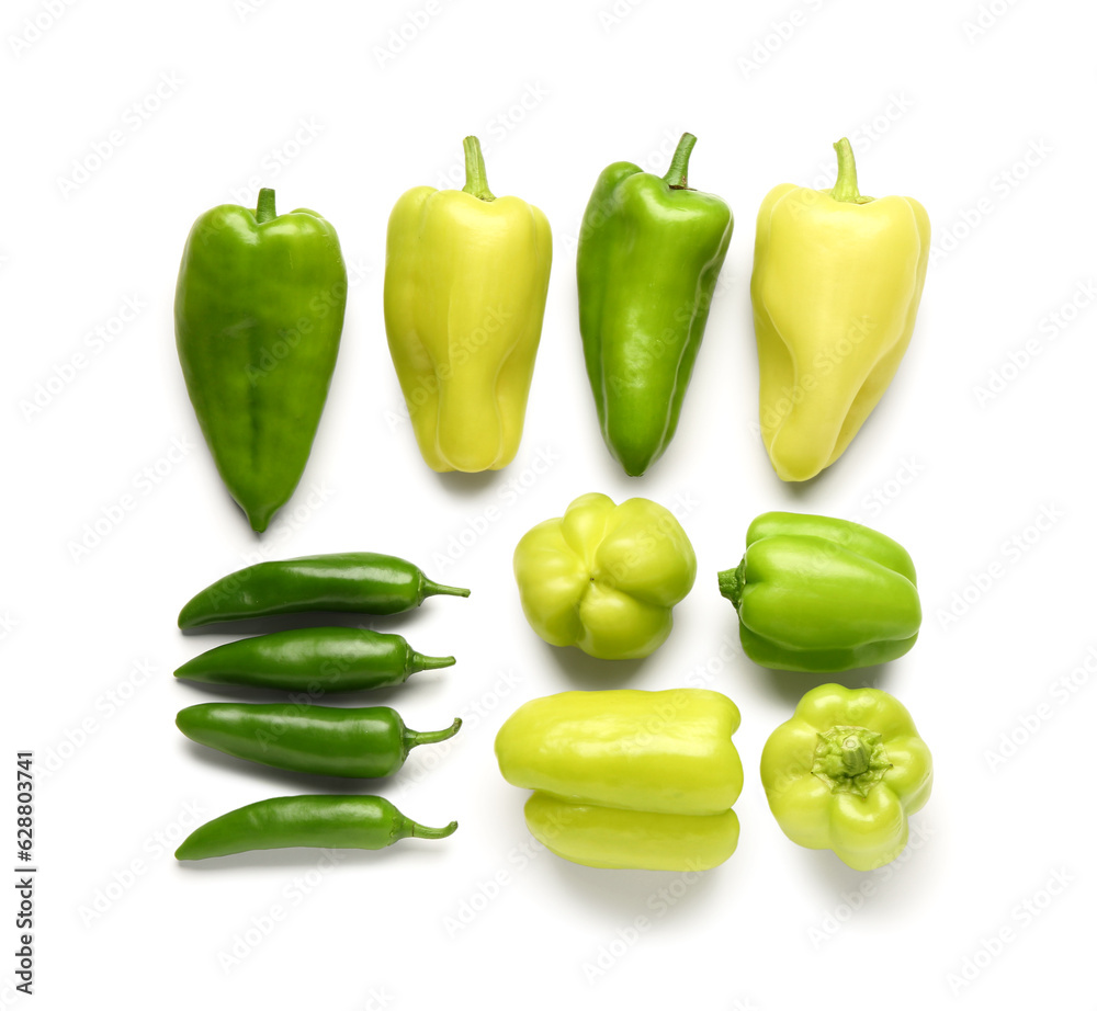 Different fresh peppers on white background