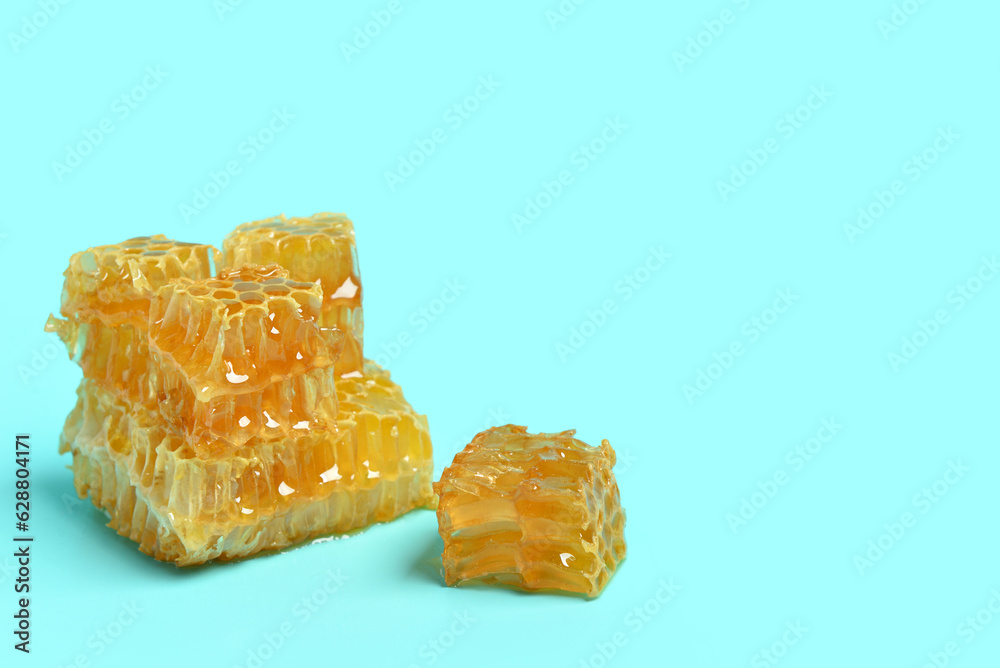 Sweet honeycombs on blue background