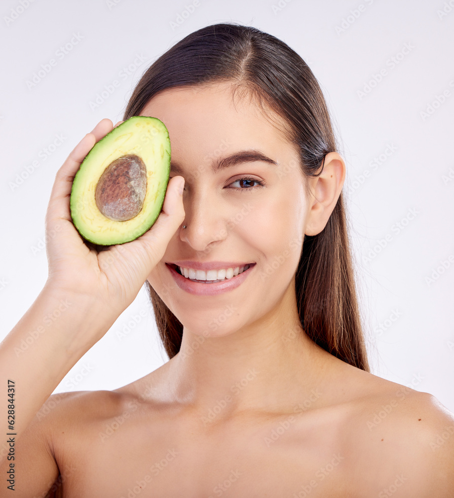 Face, skincare and happy woman with avocado for beauty isolated on a white background in studio. Por