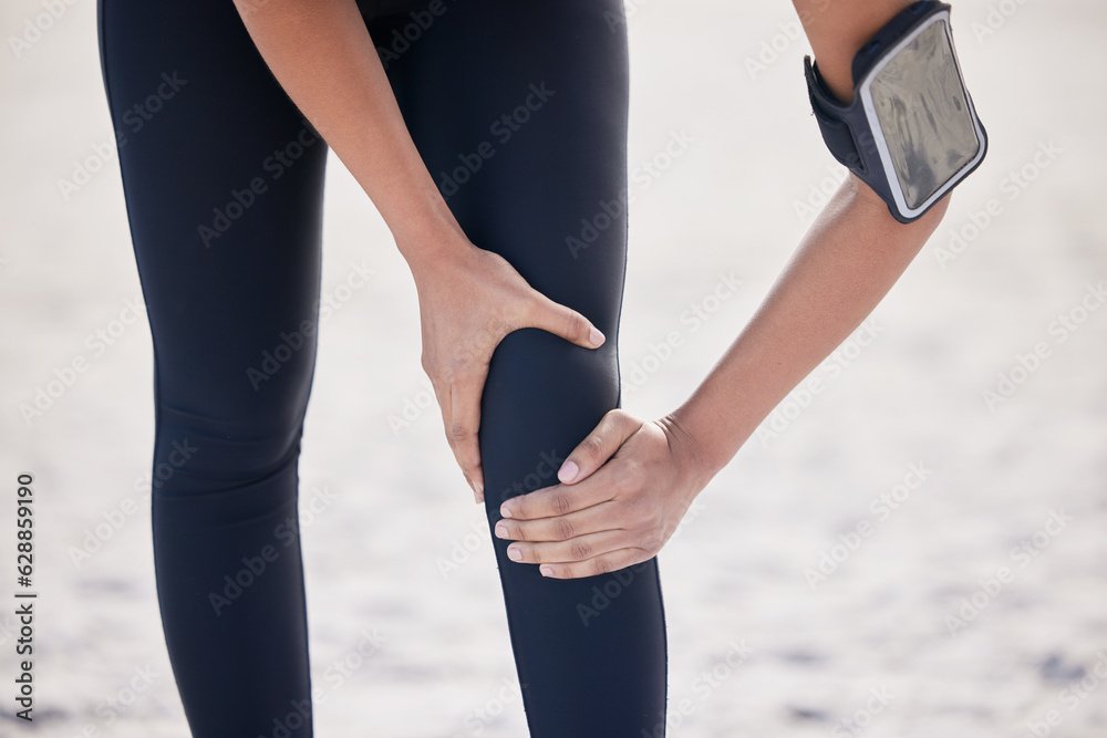 Fitness, knee pain and sports injury with woman on beach for running, inflammation and accident. Eme