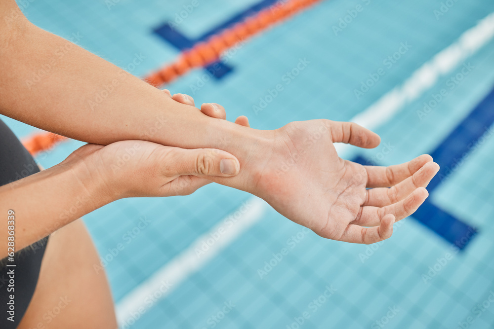 Hand, wrist pain and a swimmer by a pool in the gym closeup after emergency or accident during train