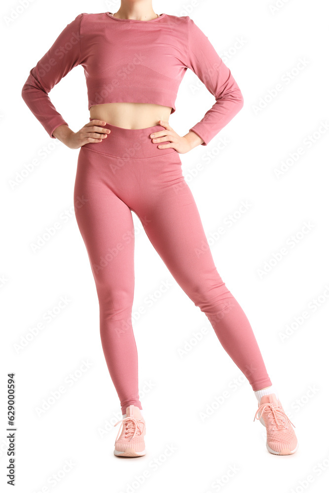 Young woman in sportswear on white background