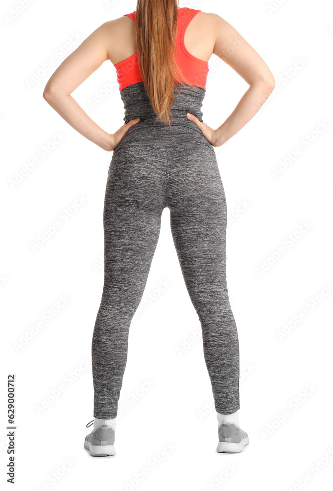 Young woman in sportswear on white background, back view