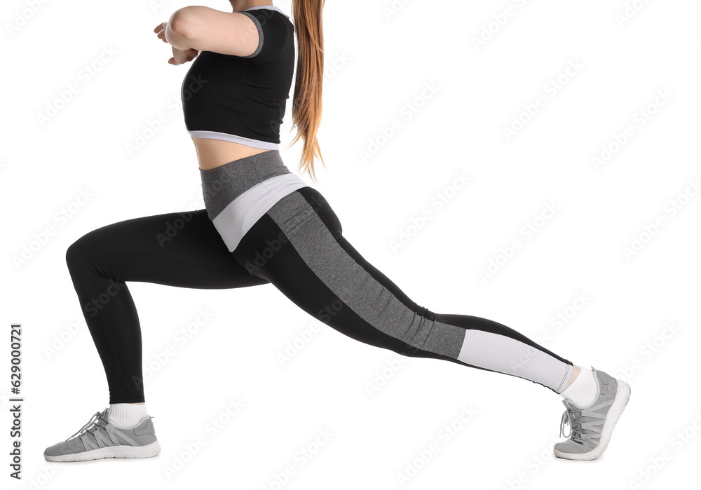 Young woman in sportswear on white background