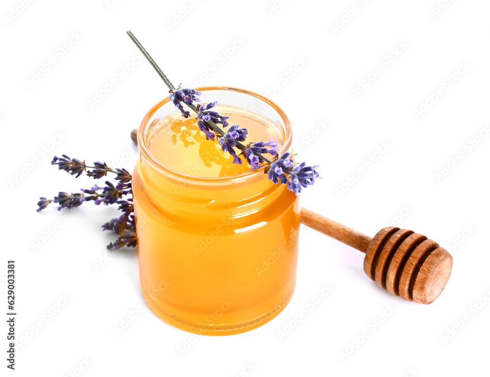 Jar of sweet lavender honey, dipper and flowers on white background