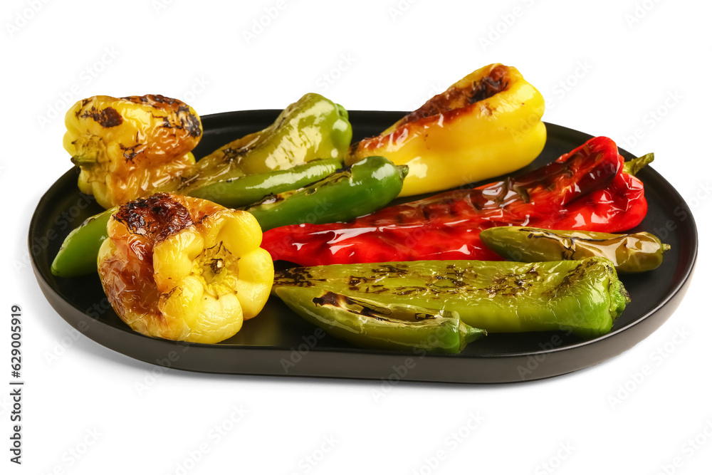 Tray with different grilled peppers on white background