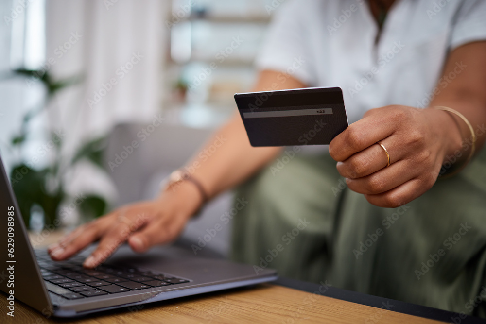 Woman, laptop and hands with credit card in ecommerce, payment or fintech banking on sofa at home. C