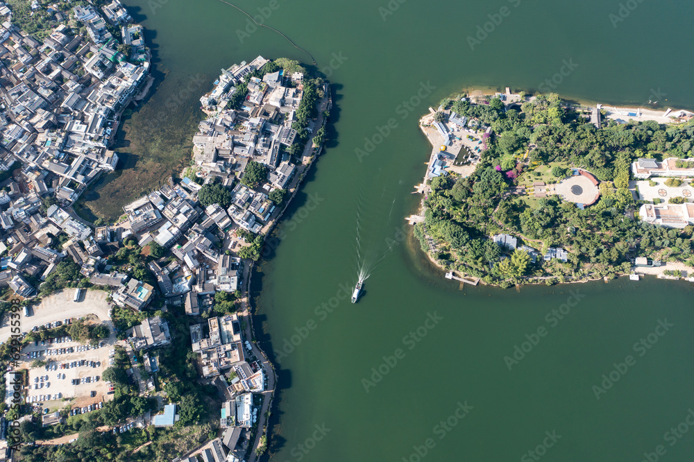 Village and lake in Shuanglang, Yunnan, China.