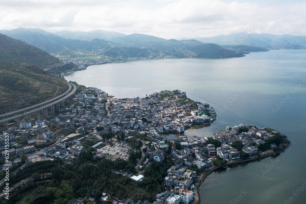 Village and lake in Shuanglang, Yunnan, China.