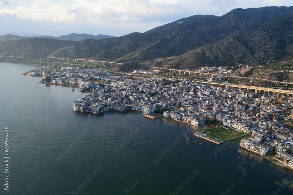 Village and lake in Shuanglang, Yunnan, China.