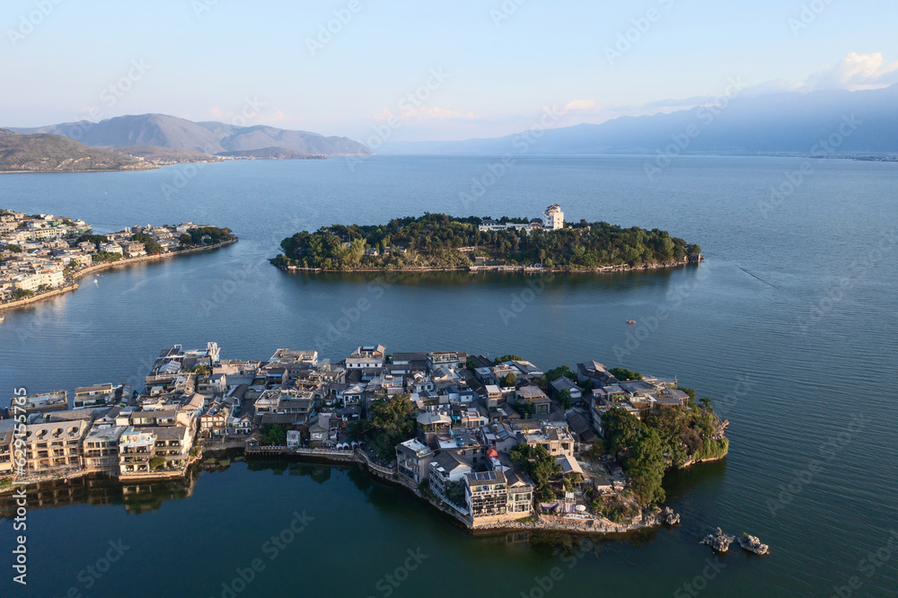 Village and lake in Shuanglang, Yunnan, China.