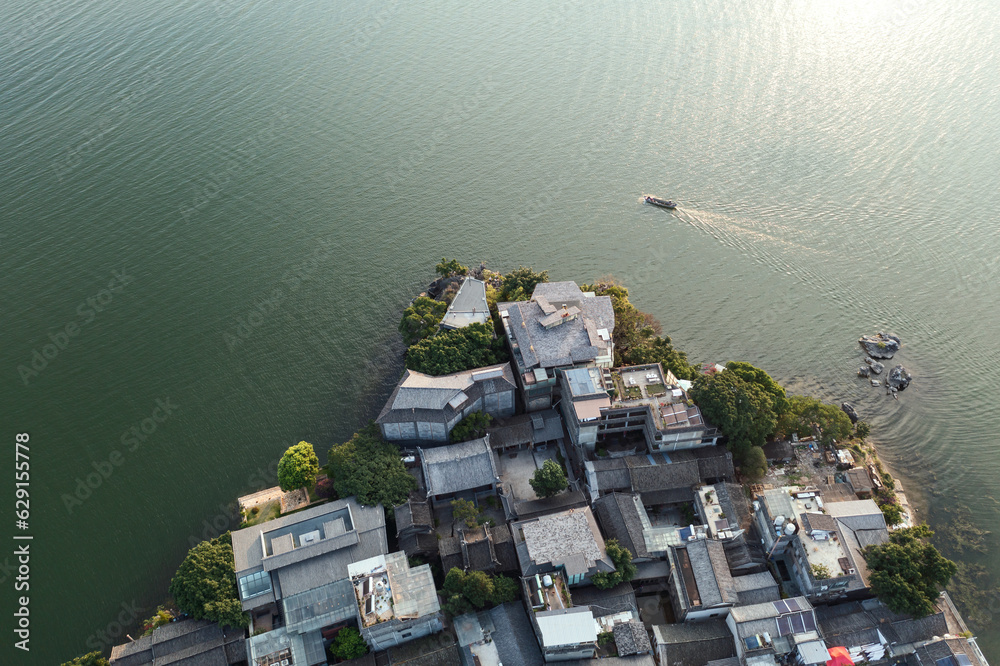 Village and lake in Shuanglang, Yunnan, China.