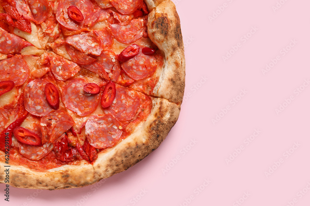 Delicious pepperoni pizza on pink background