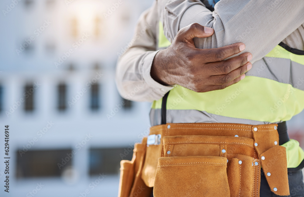 Hand, elbow and pain with a construction worker on a building site, holding a joint injury while wor