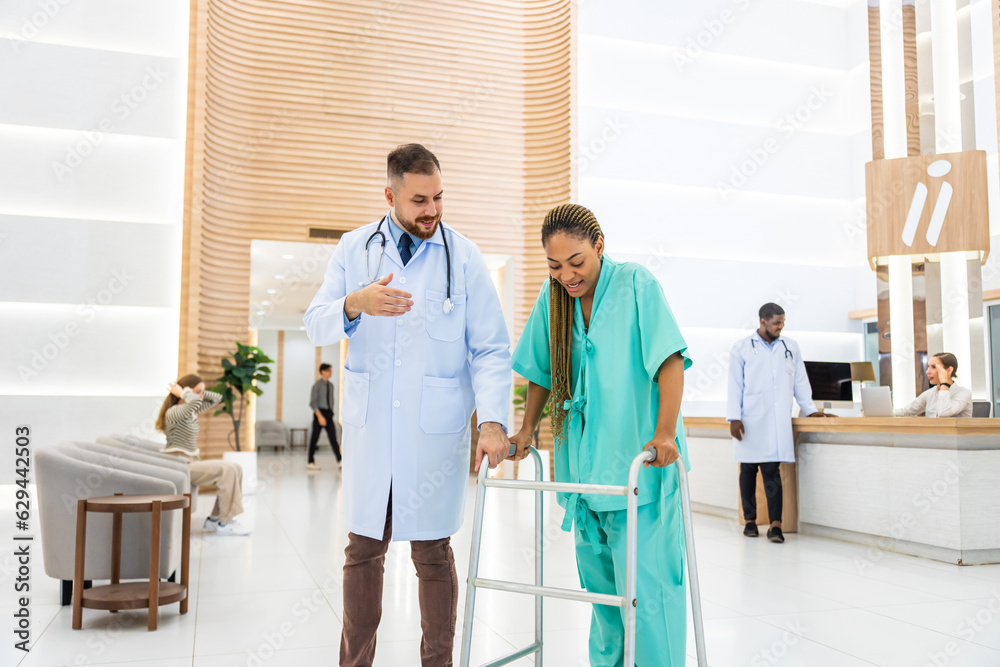 Caucasian doctors support patient walk through the hallway in hospital. 