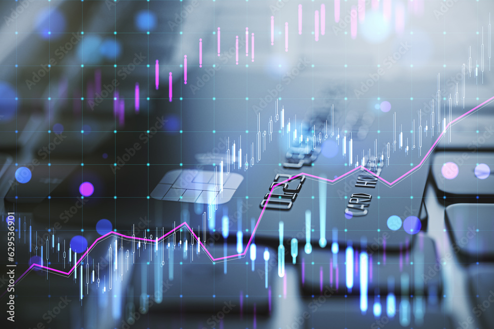 Close up of laptop keyboard and bank card with glowing candlestick forex chart on blurry background.