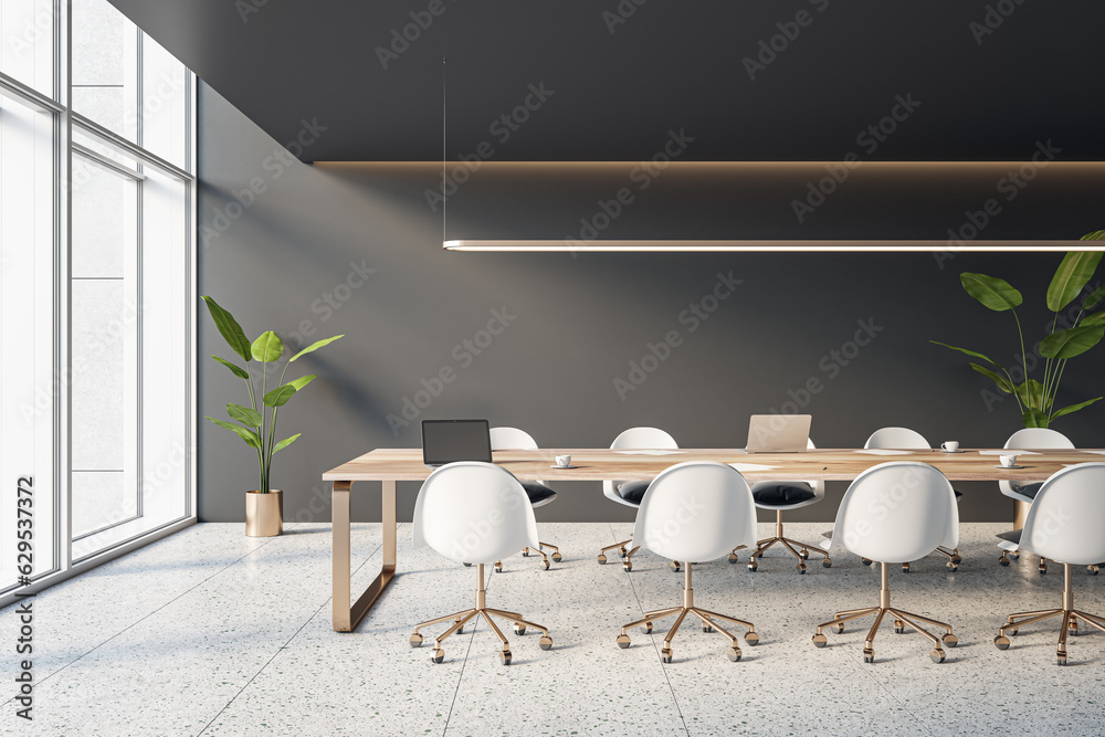 Side view of empty modern conference room with office table and chairs, panoramic window, stone floo