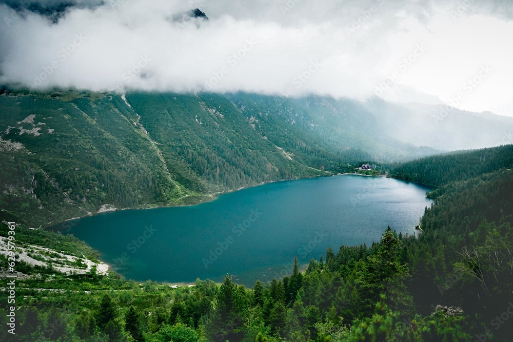 A large body of water surrounded by mountains and vistas of infinite beauty 